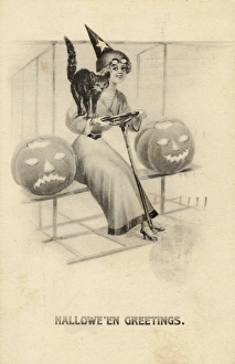 <b class=qtipBold><figcaption>Halloween/Girl/Cat/Pump</figcaption></b><br>A girl wearing a witches hat with a cat and two pumpkins<br><em>© Mary Evans Picture Library 2015 - https://copyrighthub.org/s0/hub1/creation/maryevans/MaryEvansPictureID/10019987</em> Halloween/Girl/Cat/Pump