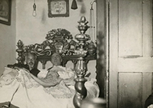 Harry Price and C. E. M. Joad lying in and investigating a s Harry Price and C. E. M. Joad lying in and investigating a s