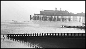 Hastings Pier, Kent - mist and figures Hastings Pier, Kent - mist and figures