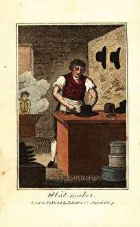 Hat maker ironing the brim of a hat made from beaver fur Hat maker ironing the brim of a hat made from beaver fur