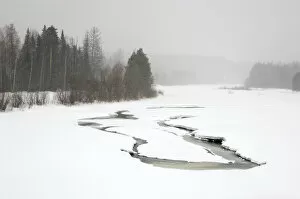 Heavy snowfall and reduced visibility over river Sosva