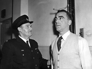 <b class=qtipBold><figcaption>Height measurement of LFB applicant</figcaption></b><br>An LFB applicant has his height measured by a senior instructor, Station Officer Butt. The brigade minimum is 5 feet 7 inches in stockinged feet.<br><em>© London Fire Brigade / Mary Evans Picture Library</em> Height measurement of LFB applicant
