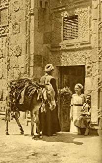 Herb seller in street, chatting to a customer, Egypt Herb seller in street, chatting to a customer, Egypt