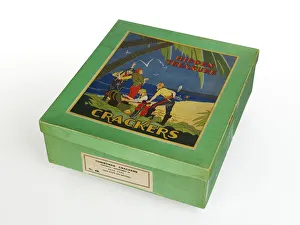 <b class=qtipBold><figcaption>Hidden Treasure Crackers</figcaption></b><br>Green cardboard cracker box with a desert island scene printed on paper on the lid, labelled 'Hidden Treasure Crackers', originally containing an 'assortment of hats, caps, good snaps and mottoes', thought to have been manufactured c.1930-1940. Date: 1930-1940<br><em>© The Geffrye Museum of the Home / Mary Evans Picture Library</em> Hidden Treasure Crackers