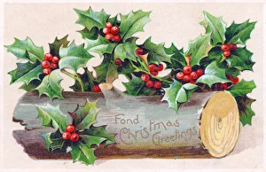 Holly and log on a Christmas postcard Holly and log on a Christmas postcard