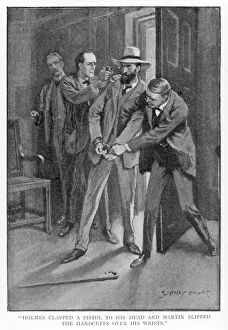 Holmes clapped a pistol to his head and Martin slipped the handcuffs over his wrists Holmes clapped a pistol to his head and Martin slipped the handcuffs over his wrists