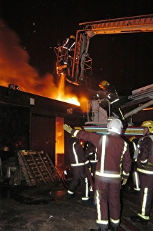 Hydraulic platform at work on fire at commercial premises Hydraulic platform at work on fire at commercial premises