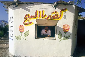 Ice cream man in kiosk, Aqaba, Jordan Ice cream man in kiosk, Aqaba, Jordan