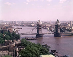 An impressive elevated view of Tower Bridge and the River Thames, London, looking east