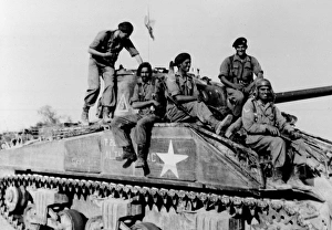 Indian tank crew astride their Sherman tank Indian tank crew astride their Sherman tank