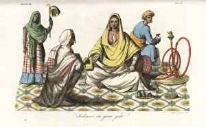 An Indian woman seated on a rich carpet attended by servants An Indian woman seated on a rich carpet attended by servants