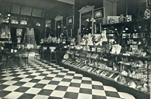 Interior of what is described as a high class confectioner's tea room with a counter Interior of what is described as a high class confectioner's tea room with a counter