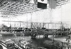 <b class=qtipBold><figcaption>Italian aircraft workshop</figcaption></b><br>An Italian aircraft workshop, probably during the First World War, with the flags of Italy and the USA visible above. Date: circa 1915-1918<br><em>© Robert Hunt Library/Mary Evans</em> Italian aircraft workshop