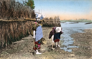 Riverbed Gallery: Japan, Two children digging for shellfish, low tide riverbed