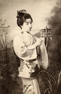 Japan - Geisha with crickets in a small cage Japan - Geisha with crickets in a small cage