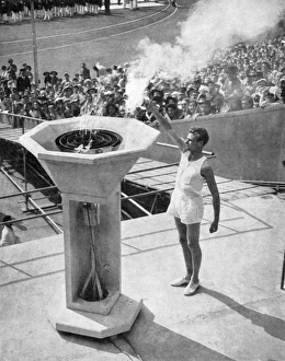 John Mark lights the Olympic bowl, opening ceremony, 1948 John Mark lights the Olympic bowl, opening ceremony, 1948