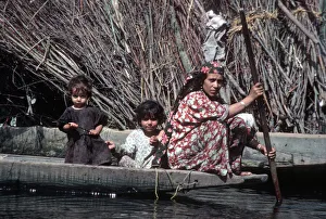 Paddling Gallery: Kashmir, River Jhelum - woman paddles a wooden boat
