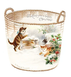 Three kittens snowballing on a cutout Christmas card Three kittens snowballing on a cutout Christmas card