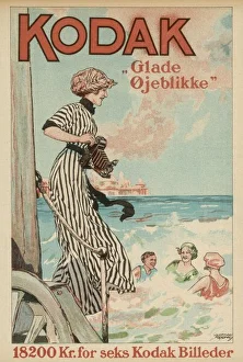 <b class=qtipBold><figcaption>Kodak Advert 1913</figcaption></b><br>A lady uses her Kodak camera at the seaside<br><em>© Mary Evans Picture Library</em> Kodak Advert 1913