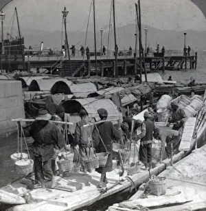 Labourers unloading a barge, Hong Kong, c.1900 Vintage early 20th century photograph Labourers unloading a barge, Hong Kong, c.1900 Vintage early 20th century photograph