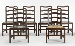 <b class=qtipBold><figcaption>Six ladder-back chairs</figcaption></b><br>One of six matching walnut ladder-back chairs. It lacks its original seat, but the seat rails bear slight indentations that indicate that it was most likely to have been made with a rush seat. Supplied or manufactured by the workshop of Giles Grendey, London, c.1740-1750. Date: c.1740-1750<br><em>© The Geffrye Museum of the Home / Mary Evans Picture Library</em> Six ladder-back chairs