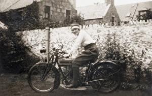 Lady sitting on 1918 Triumph motorcycle Lady sitting on 1918 Triumph motorcycle