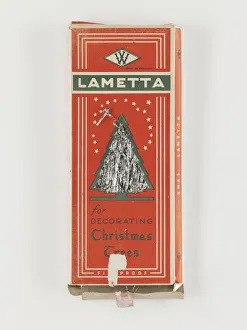 <b class=qtipBold><figcaption>Lametta box</figcaption></b><br>Lametta for Decorating Christmas Trees', a cardboard box containing strips of silver lametta, manufactured in England, c.1930-1940. Date: c.1930-1940<br><em>© The Geffrye Museum of the Home / Mary Evans Picture Library</em> Lametta box
