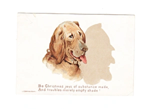 Large dog casting a shadow on a Christmas card Large dog casting a shadow on a Christmas card