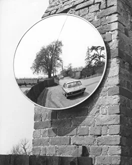 Large mirror on a wall at the roadside Large mirror on a wall at the roadside