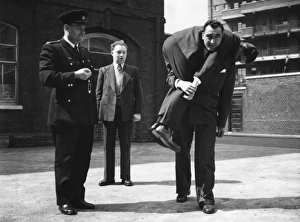 <b class=qtipBold><figcaption>LFB strength test for recruits</figcaption></b><br>LFB strength test -- every recruit must carry a man of approximately his own weight 100 yards in one minute.<br><em>© London Fire Brigade / Mary Evans Picture Library</em> LFB strength test for recruits