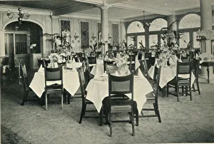 A light and airy restaurant dining-room with starched white tablecloths A light and airy restaurant dining-room with starched white tablecloths