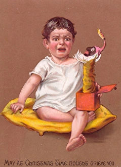 Little boy with jack in the box on a Christmas card Little boy with jack in the box on a Christmas card