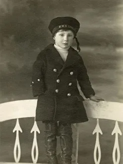 Little Boy in a studio portrait in a HMS Lion sailors cap Little Boy in a studio portrait in a HMS Lion sailors cap