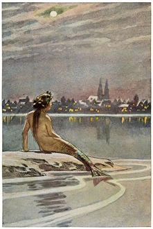 <b class=qtipBold><figcaption>The Little Meraid</figcaption></b><br>The little mermaid sits on a rock and gazes at the lights of the distant town<br><em>© Mary Evans Picture Library</em> The Little Meraid