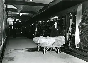 Trains In The 1970s Prints: Loading the Mail Train