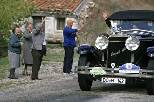 Local people wave to driver of a vintage Hispano Suiza car Local people wave to driver of a vintage Hispano Suiza car