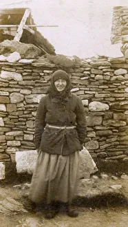 A Local Woman of the Orkney Islands outside her house A Local Woman of the Orkney Islands outside her house