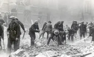 Prints of The aftermath of a V1 flying bomb attack in Winchester Street, Pimlico. NFS firefighters join other rescue workers at the scene Fire Brigade Prints: The Aftermath of a V1 Bombing Attack in Pimlico Print