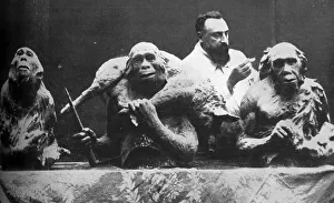 Louis Mascre with sculptures of evolutionary man Louis Mascre with sculptures of evolutionary man