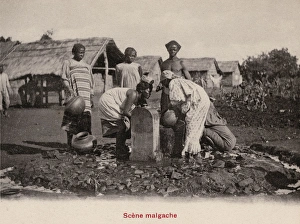 Madagascan women gathering water from a fountain Madagascan women gathering water from a fountain