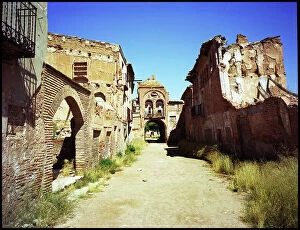 Images Dated 8th December 2015: Main street with gatehouse, Belchite, Spain
