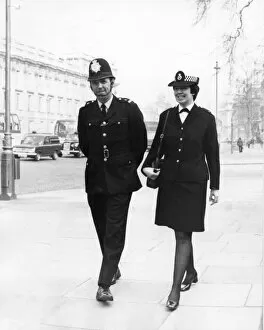 Male and female police officers on duty in London