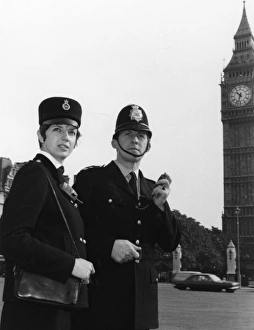 Male and female police officers in Westminster, London Male and female police officers in Westminster, London