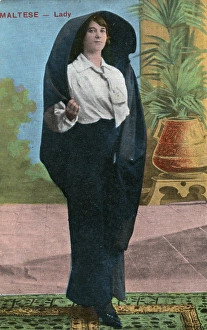 A Maltese lady wearing a traditional over-head shawl A Maltese lady wearing a traditional over-head shawl