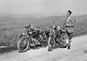 Man on country lane with two motorbikes Man on country lane with two motorbikes