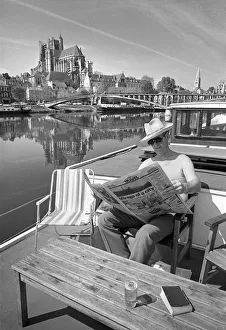 Man on houseboat, Auxerre sur Yonne, France Man on houseboat, Auxerre sur Yonne, France
