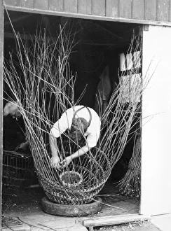 Man making lobster pot at Beesands, Start Bay, Devon Man making lobster pot at Beesands, Start Bay, Devon