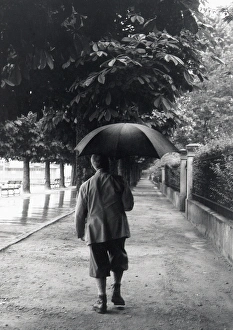 Man in plus fours in the rain, Lucerne, Switzerland Man in plus fours in the rain, Lucerne, Switzerland