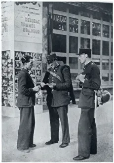 Man shows identity papers to gendarmes, September 1939 Man shows identity papers to gendarmes, September 1939