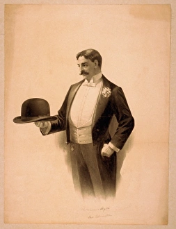 Man wearing tuxedo, holding bowler hat Man wearing tuxedo, holding bowler hat